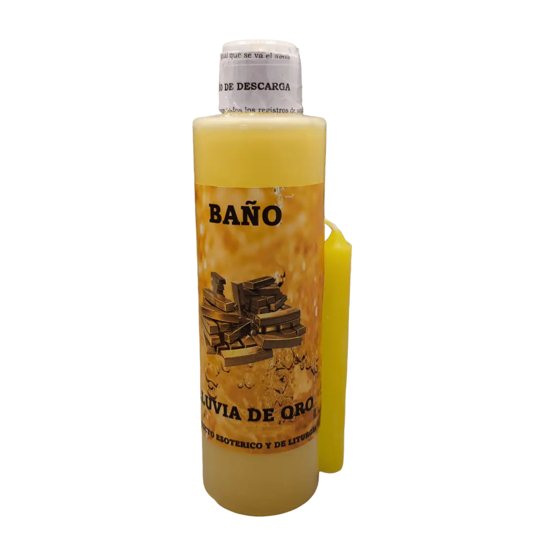 Garrafa de Banho Liquido Chuva de Ouro ao lado de uma vela amarela acesa e folheto com instrucoes de uso