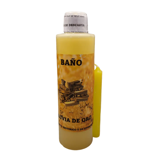 Garrafa de Banho Liquido Chuva de Ouro ao lado de uma vela amarela acesa e folheto com instrucoes de uso