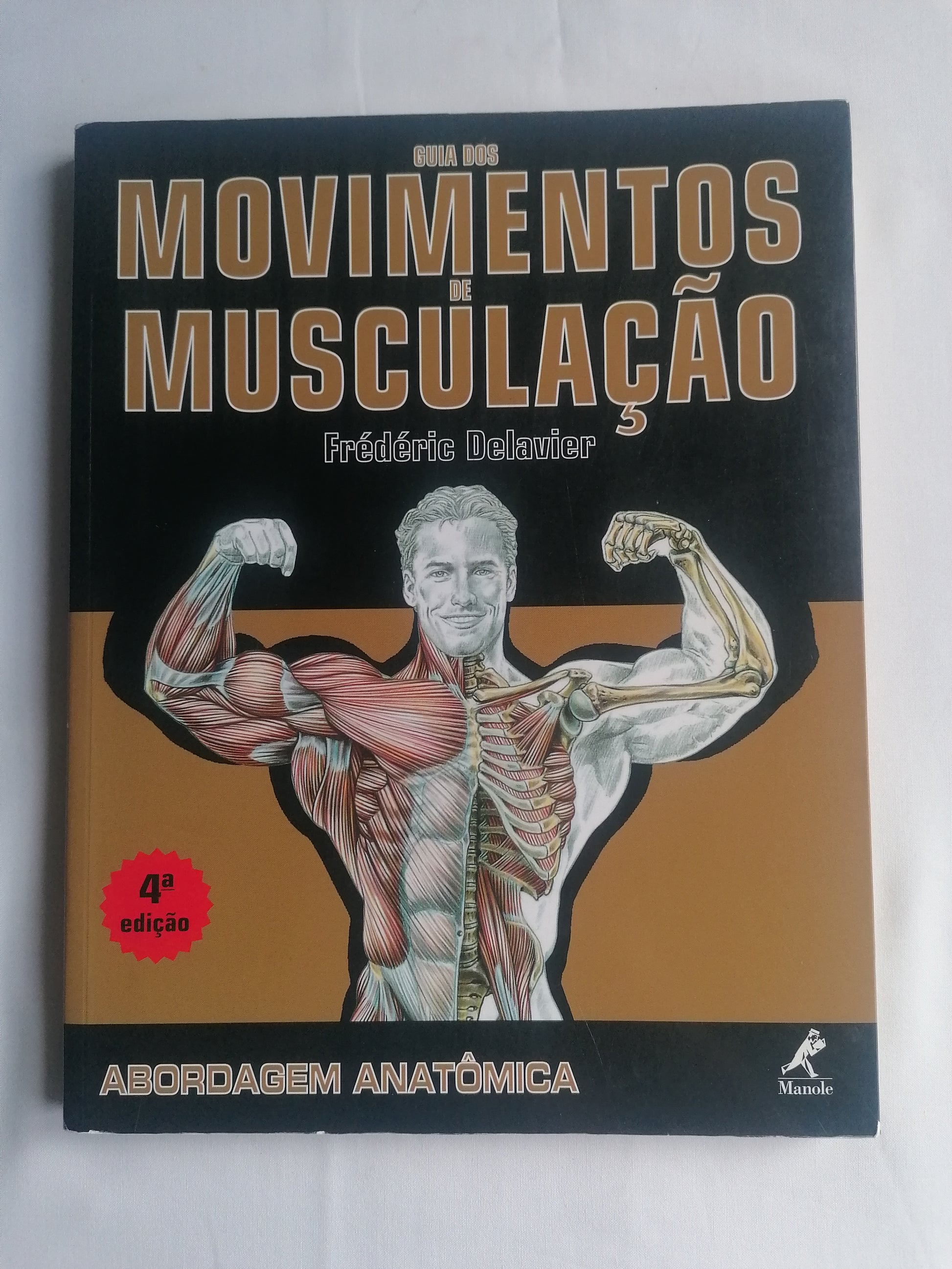 Guia anatómico de Delavier, 4ª edição, mostrando detalhadamente o funcionamento muscular no treino.