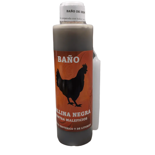 Garrafa de Banho Liquido Galinha Negra ao lado de uma vela acesa e folheto explicativo para quebra de demanda e maleficios