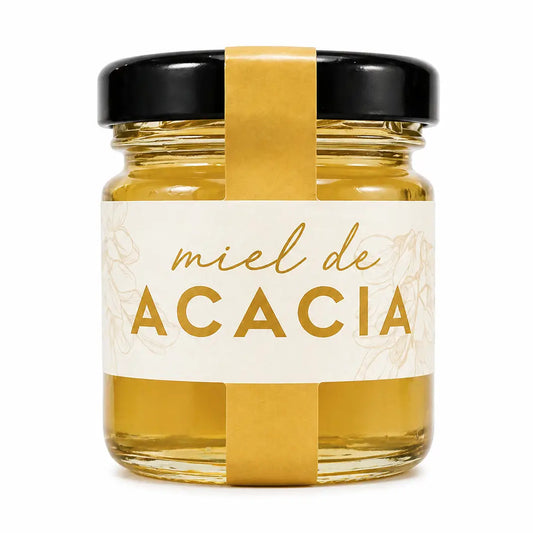 Frasco de Mel de Acácia de 50g com textura fina, tom âmbar claro transparente e produção artesanal
